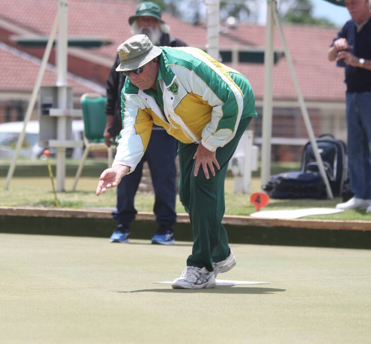 FOCUS: Tim Pickstone in action during Saturday's mixed pairs final at the Majellan Bowling Club. Photo: PHIL BLATCH