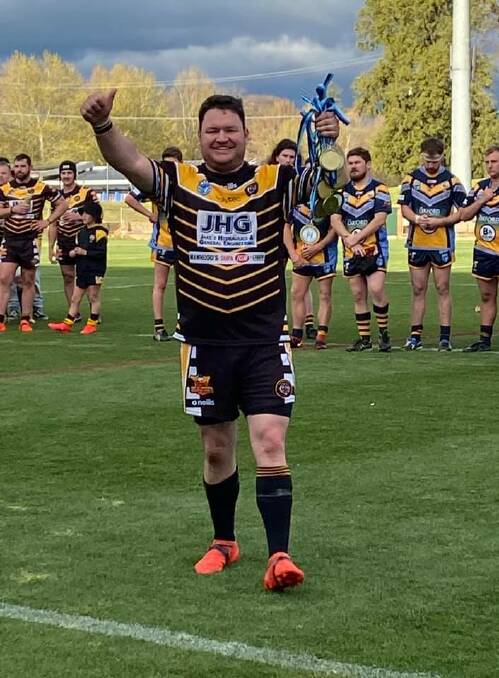 MOMENT OF TRIUMPH: Oberon coach Dallas Booth holds the Mid West League Cup premiership medals after his Tigers beat CSU in the decider. Photo: OBERON TIGERS FACEBOOK