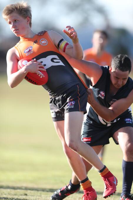 PULLING AWAY: Aiden Macauley and his fellow Giants beat Dubbo on Saturday to open up a four-point buffer over the Demons on the ladder. Photo: PHIL BLATCH