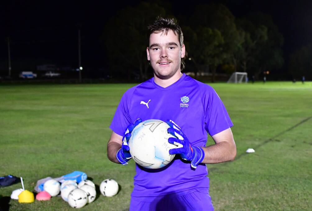 SOLID WORK: Bathurst '75 goalkeeper Jack Hunter made a string of good saves late in Saturday's match against Parkes United. Photo: BRADLEY JURD