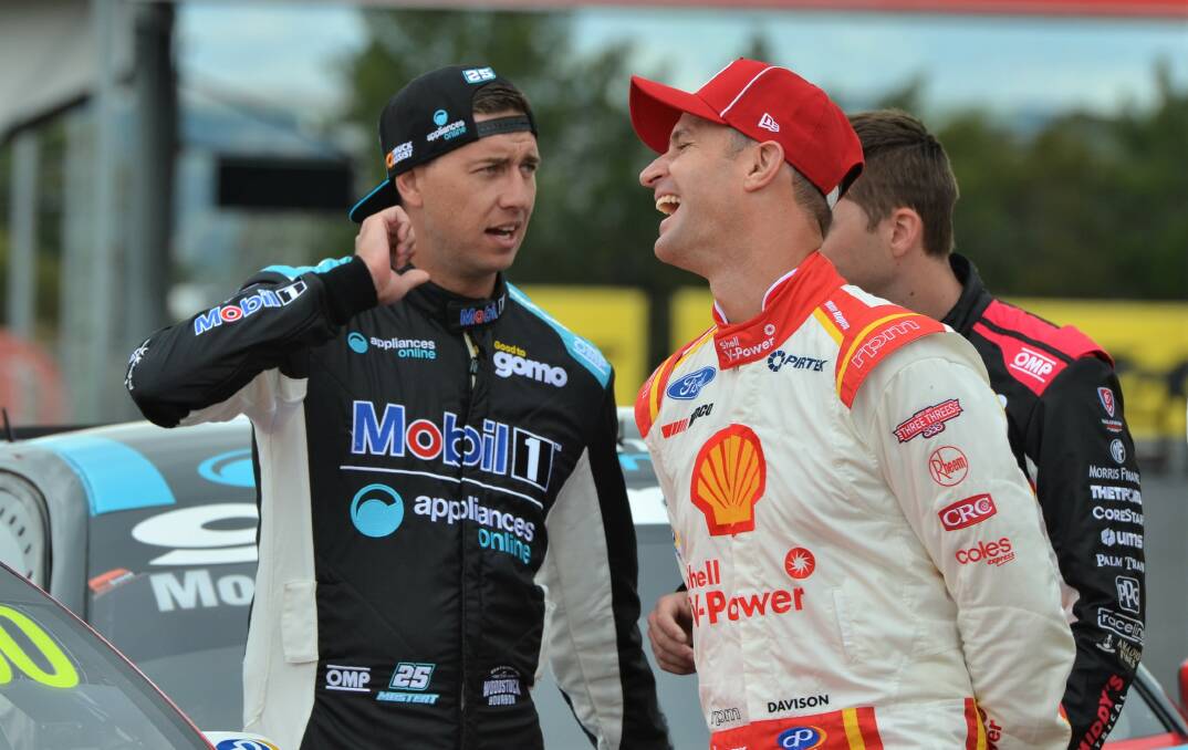 EXCITED: Will Davison (right) shares a left with Supercars rival Chaz Mostert at Mount Panorama ahead of the Bathurst 500.