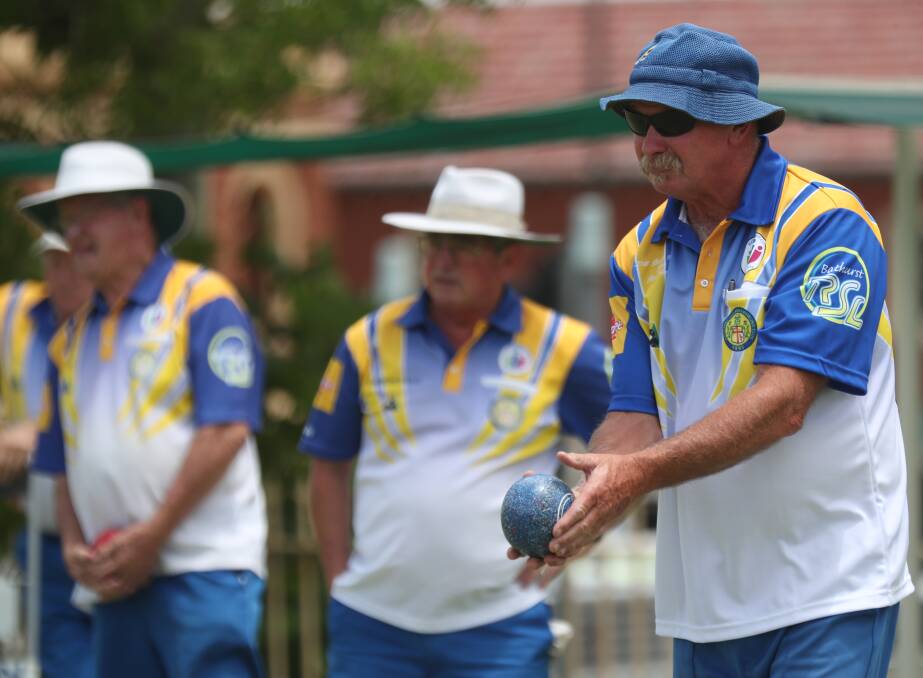 LINING IT UP: Ross James lines up a shot while on the greens at the Bathurst City Bowling Club. Photo: PHIL BLATCH