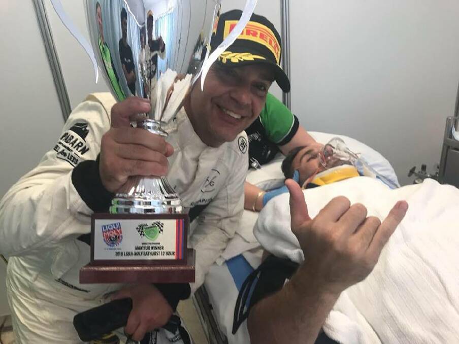 MIXED DAY OUT: James Koundouris and Ash Walsh with the AM Class trophy they won despite a Bathurst 12 Hour crash. Photo: ASH WALSH FACEBOOK