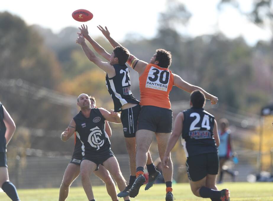 The Bathurst Giants were too good for the Cowra Blues in Saturday's Central West AFL match at George Park 2. Photos: PHIL BLATCH