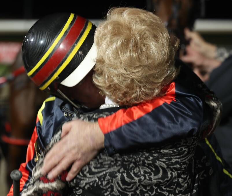 DYNAMIC DUO: Colin McDowell and his wife Cheryl share a moment after last year's Gold Tiara victory with Michelle Lee Mac. Photo: PHIL BLATCH