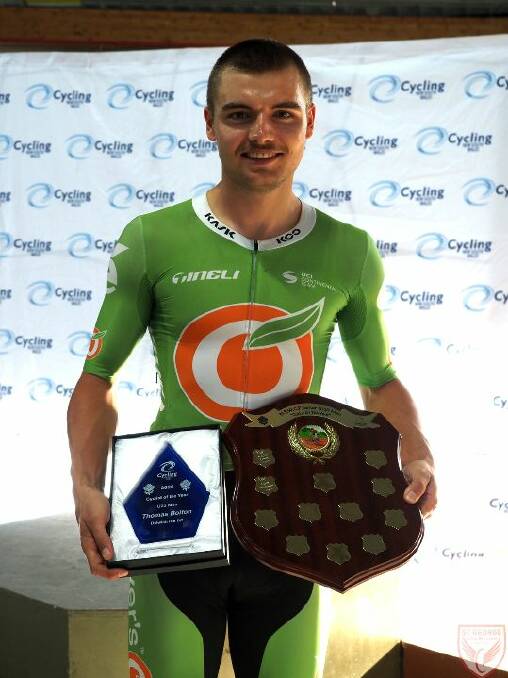 THE SPOILS: Tom Bolton with his Cycling NSW award. Photo: MORGAN HO