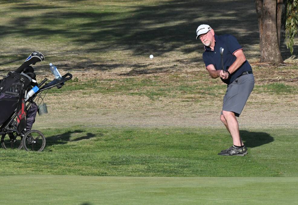 CHIPPING ON: Mark Nelson eyes off the pin on the 18th green during the Bathurst Golf Club's monthly medal. Photo: CHRIS SEABROOK 100519cgolf1b