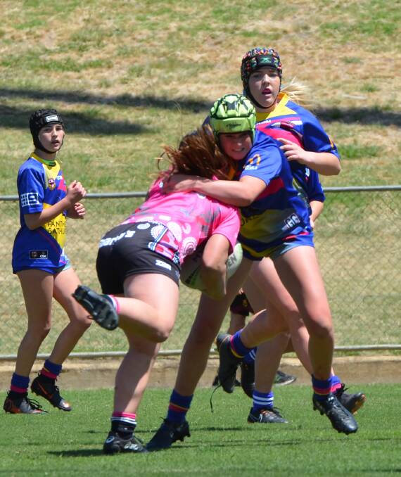 GOT YOU: Kate Fallon stops a Goannas rival while playing league for the Platypi. This Sunday she will play rugby 7s for the Waratahs.