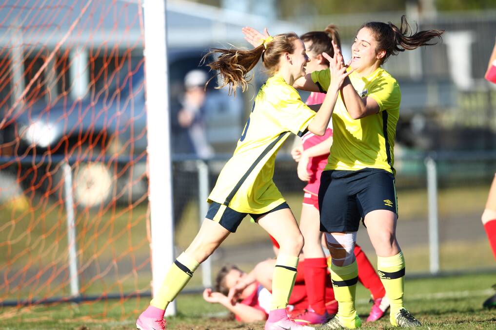 RAPID RISE: Five years ago Cushla Rue celebrated with team-mate Jess Salomoni after scoring her first top grade goal for Western NSW. Now she's on tour with the Young Matildas. Photo: PHIL BLATCH