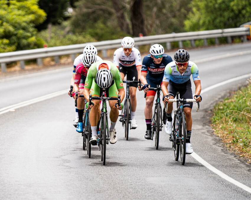 WORKING HARD: Tom Bolton takes a turn at the front of the breakaway group during the under 23s road road. Photo: ZAC WILLIAMS\CYCLING AUSTRALIA