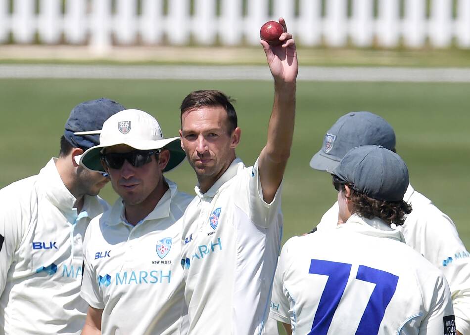 MOMENT TO REMEMBER: Star Bathurst cricketer Trent Copeland raises the ball after taking 5-17 against Queensland last week. Photo: AAP/CRICKET AUSTRALIA
