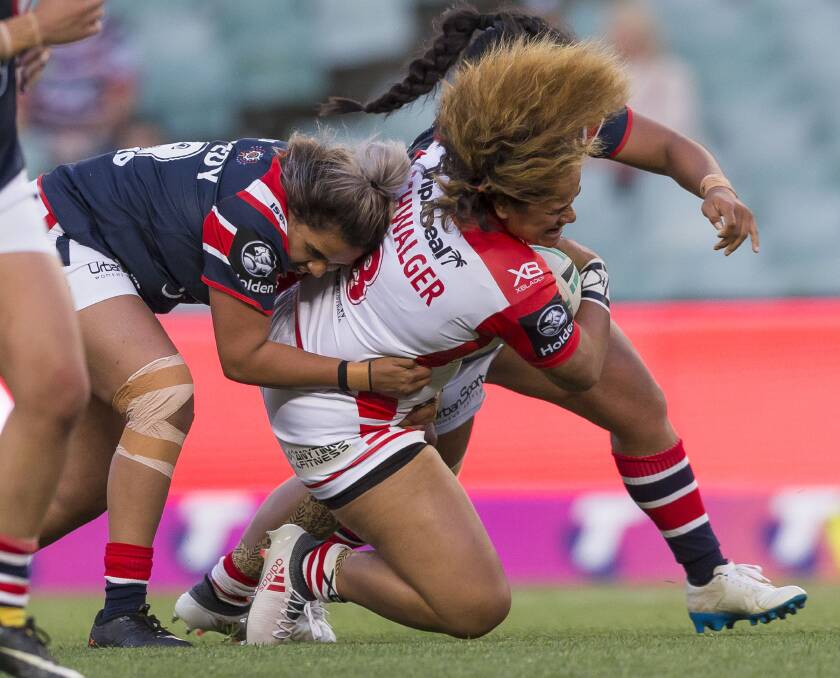 GOT YOU: Kandy Kennedy drags down an Dragons rival during the WNRL season. She has now been named in the Indigenous All Stars squad. Photo: AAP