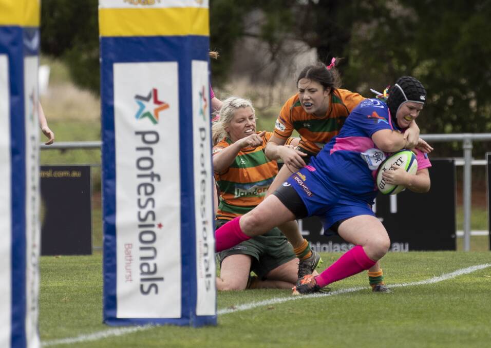 AND SHE'S OVER: Bathurst Bulldogs forward Marita Shoulders scored her first try of the year in Saturday's win over Orange City. Photo: TIM HULME