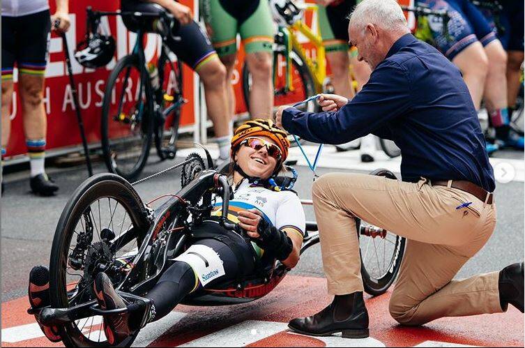 WELL DONE: Bathurst handcyclist Emilie Miller is presented with her silver medal by Santos' Angus Jaffray. Photo: CONTRIBUTED