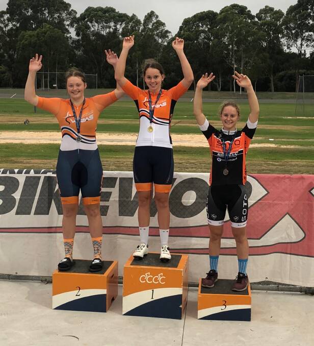 TRACK STARS: Bathurst Cycling Club talents and WRAS squad members Kalinda Robinson (centre) and Tyler Puzicha (left) stand on the under 17 women's state omnium podium. Photo: CONTRIBUTED