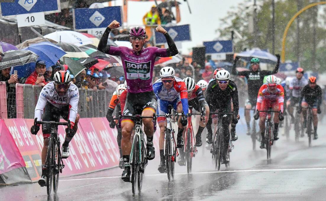 TOUGH DAY OUT: Germany's Pascal Ackermann celebrates as he sprints to win the fifth stage of the Giro d'Italia in heavy rain. Mark Renshaw's team-mate Ryan Gibbons placed sixth. Photo: ANSA via AP