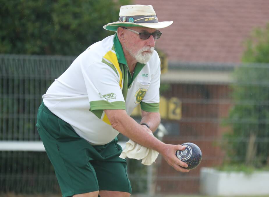 LINING IT UP: Barry Quigley contemplates his next shot while playing at the Majellan Bowling Club on Saturday. Photo: PHIL BLATCH 020919pbbowls3