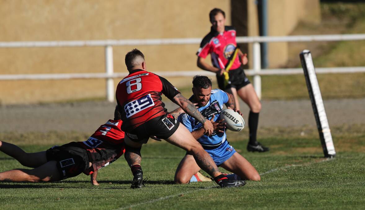 FOUR POINTER: Bathurst Panthers talent and Group 10 centre Jeremy Gordon about to plant the ball for a try. Photo: PHIL BLATCH