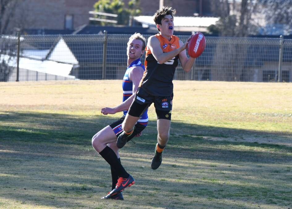 GOOD GRAB: Bailey Brien was one of the younger Giants to impress against Parkes. Photo: CHRIS SEABROOK