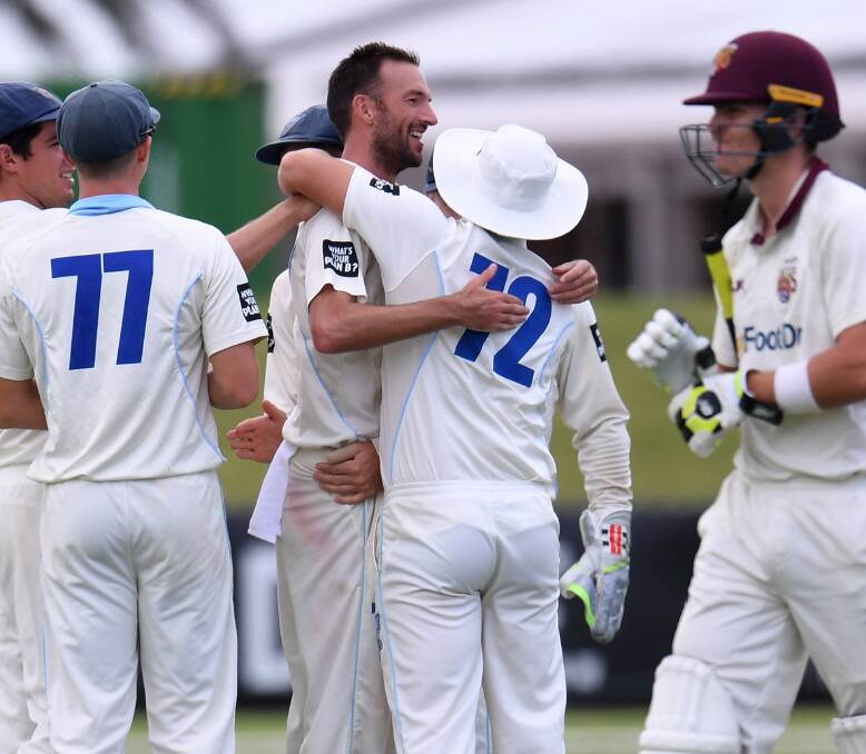 NICE WORK: Trent Copeland celebrates after taking one of his five wickets on day one in NSW's shield match against Queensland. It was an effort which helped the Blues to a first innings lead. Photo: AAP