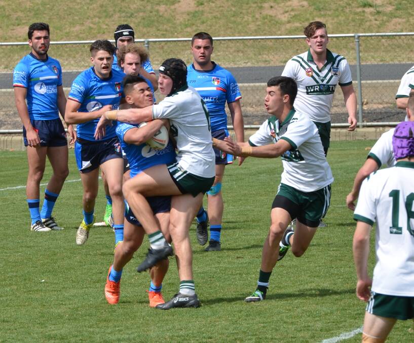 FLASHBACK: Matt Burton, with Charlie Stanies watching on, in action for the Western Rams in a 2017 match at Carrington Park. The duo have since gone on to impress in the NRL. Photo: ANYA WHITELAW