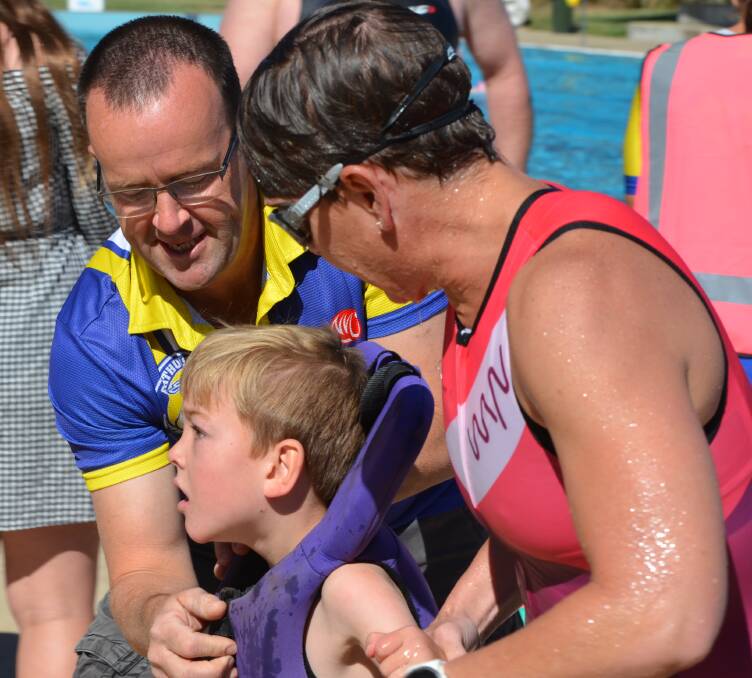 GETTING INVOLVED: Luke and Danielle Patterson, pictured with their son Lachlan during a recent race, came up with idea for Bathurst's tri-ability event. Photo: ANYA WHITELAW