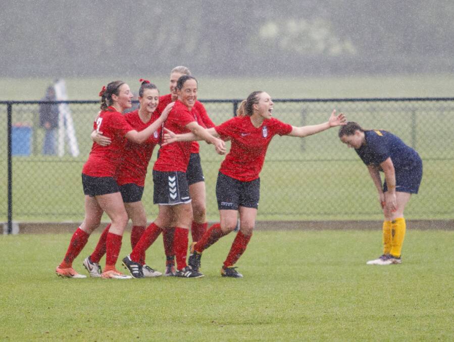 THE JOY: Teegan Ward (right) is joined by some of her Panorama team-mates to celebrate her late goal. It handed Panorama a 3-2 grand final win over Abercrombie. Photo: BEN FRY