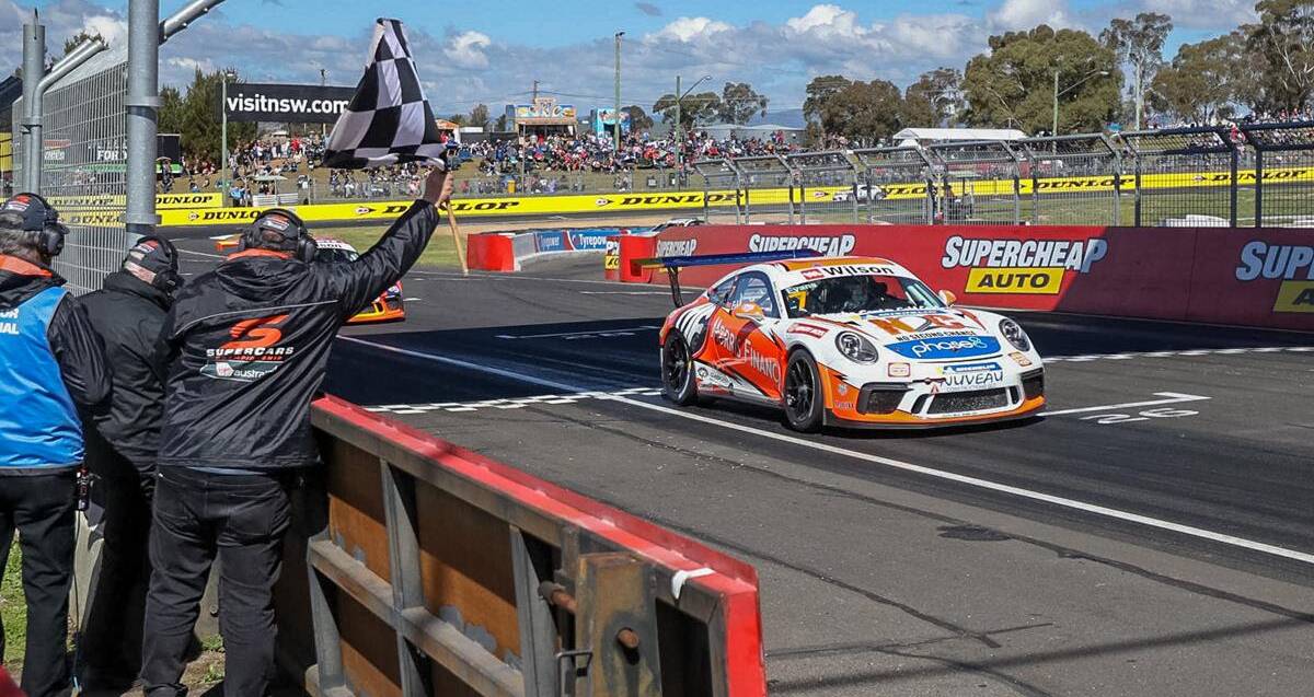 REPEAT: Jaxon Evans claims the chequered flag at Mount Panorama during a Carerra Cup race last October. He will be looking for another in the Bathurst 12 Hour.