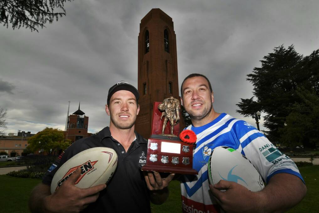 BIG CLASH: The ANZAC trophy is one that both Panthers Doug Hewitt and Pat's Zac Merritt want to win on Saturday. Photo: CHRIS SEABROOK