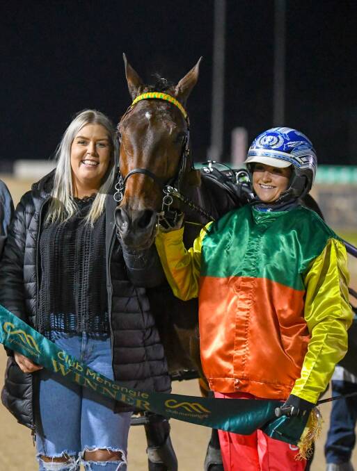 Trainer Mckayler Barnes and driver Olivia Frisby celebrated a metropolitan first on Saturday night when $61 outsider Kingston Shannon saluted. Picture by Racing at Club Menangle