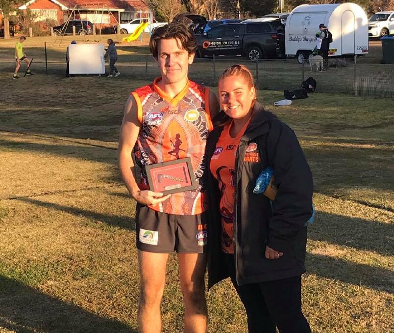 BEST ON GROUND: Bailey Brien is presented his best on ground award by Bathurst Giants Indigenous player Hailee Provest. Photo: AFL CENTRAL WEST
