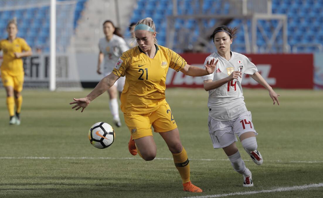 FRANCE BOUND: Ellie Carpenter and her fellow Matildas qualified for next year's World Cup thanks to a 1-all draw against Japan.