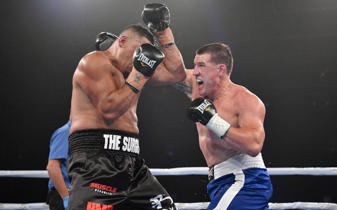 BRING IT ON: Paul Gallen (left), pictured in action against John Hopoate, insists he will beat Mark Hunt this October. There's a chance Bathurst could host that showdown. Photo: NO LIMIT BOXING