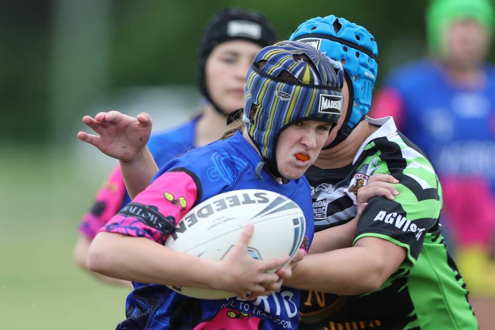 GETTING STUCK IN: Tiana Monks tries to palm off a Castlereagh rival in the increasingly popular WWRL competition. Photo: PHIL BLATCH