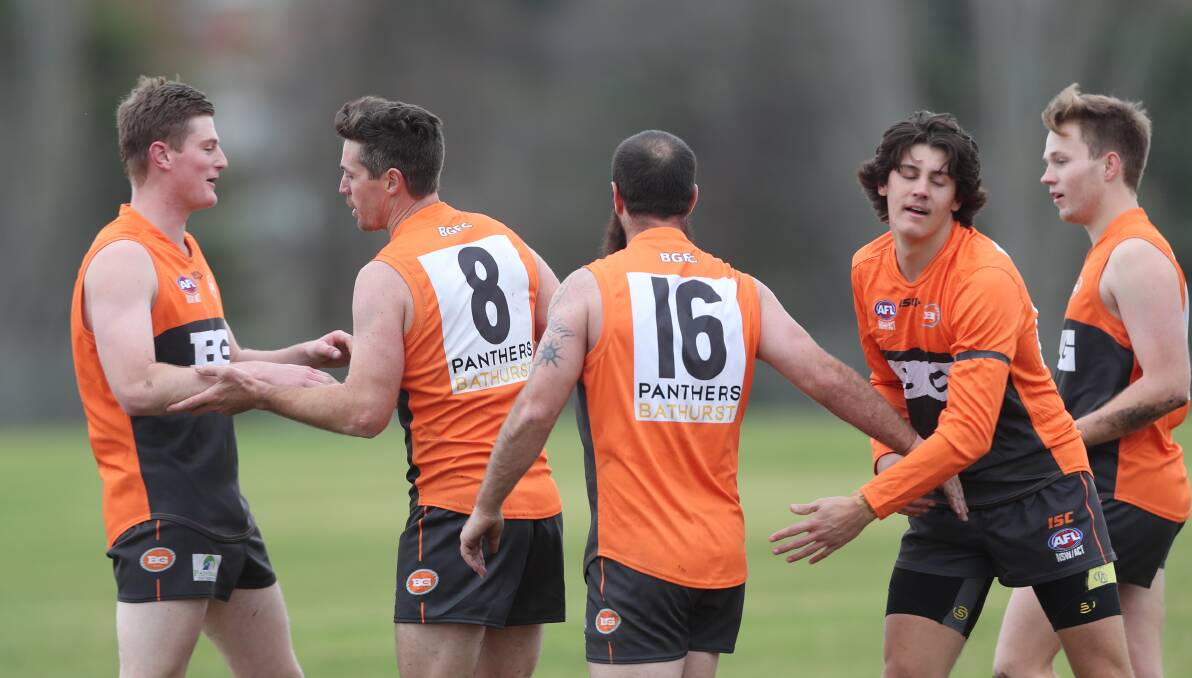 STAR RECRUIT: Lenny Hayes (#8) celebrates with his new Bathurst Giants team-mates on Saturday after kicking a goal. Photo: PHIL BLATCH
