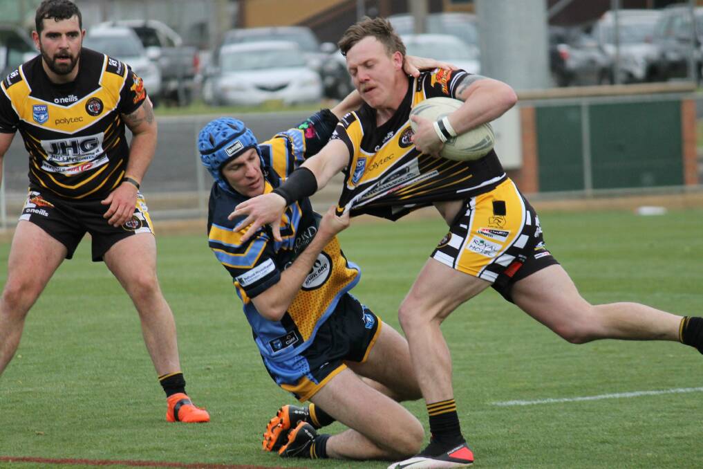 STRONG PERFORMER: Playmaker Blake Fitzpatrick runs at the CSU line during the Mid West League Cup grand final.