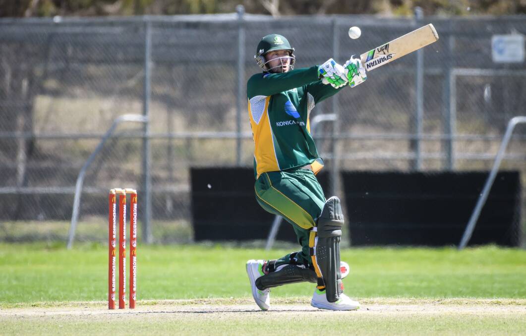 AIMING UP: Blake Dean swings hard for Weston Creek Molonglo during the ACT Regional T20 Cup semi-final against ANU in 2017. Photo: SITTHIXAY DITTHAVONG