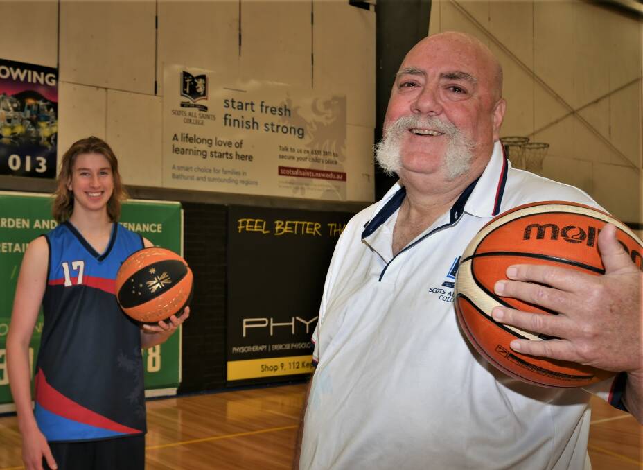 LONG SERVICE: Tony Lewis, pictured with Scots All Saints College player Luc Fenton, has been coaching students for 30 years. Photo: CHRIS SEABROOK