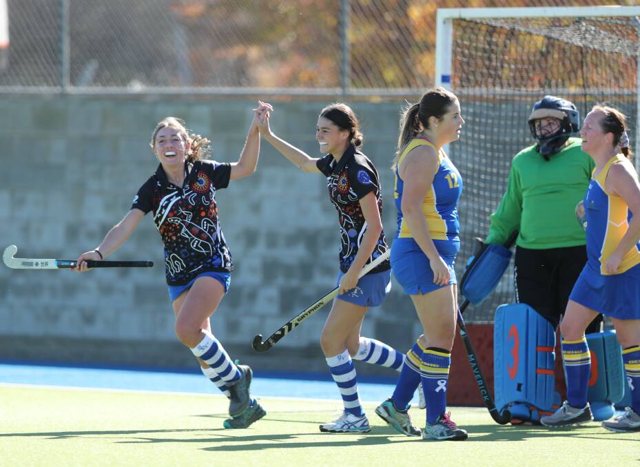 WEAPONS: Lilly Kable and Millie Fulton celebrate after one of the four goals they scored between them in the Saints' win over Exies. Photo: PHIL BLATCH