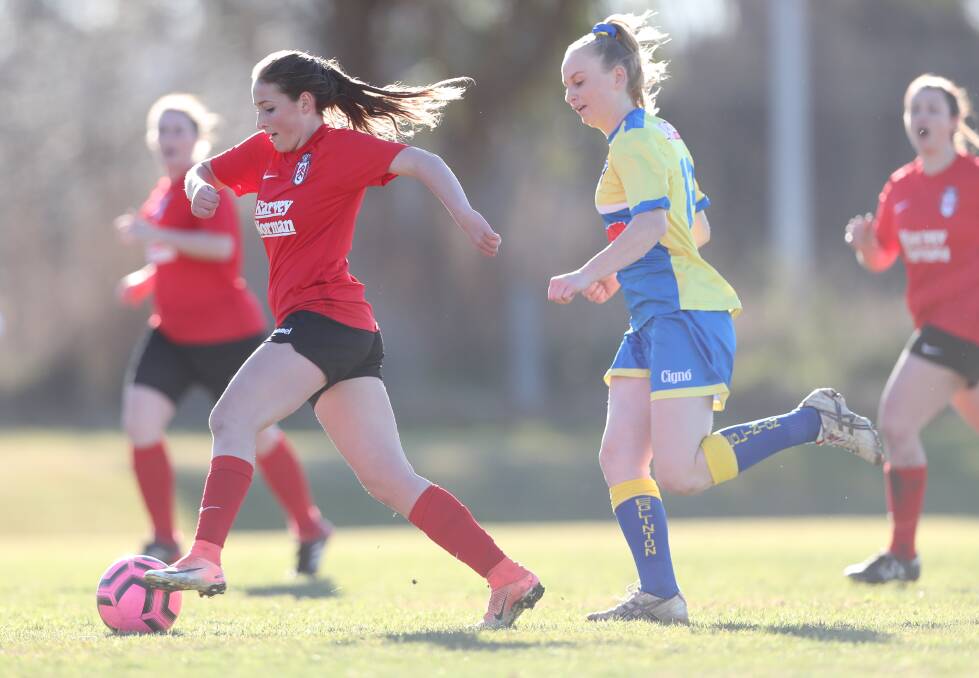 ON THE BOAD: Panorama's Laura Risch, being chased by Eglinton's Lauren Dove, scored one of her side's four goals on Sunday. Photo: PHIL BLATCH