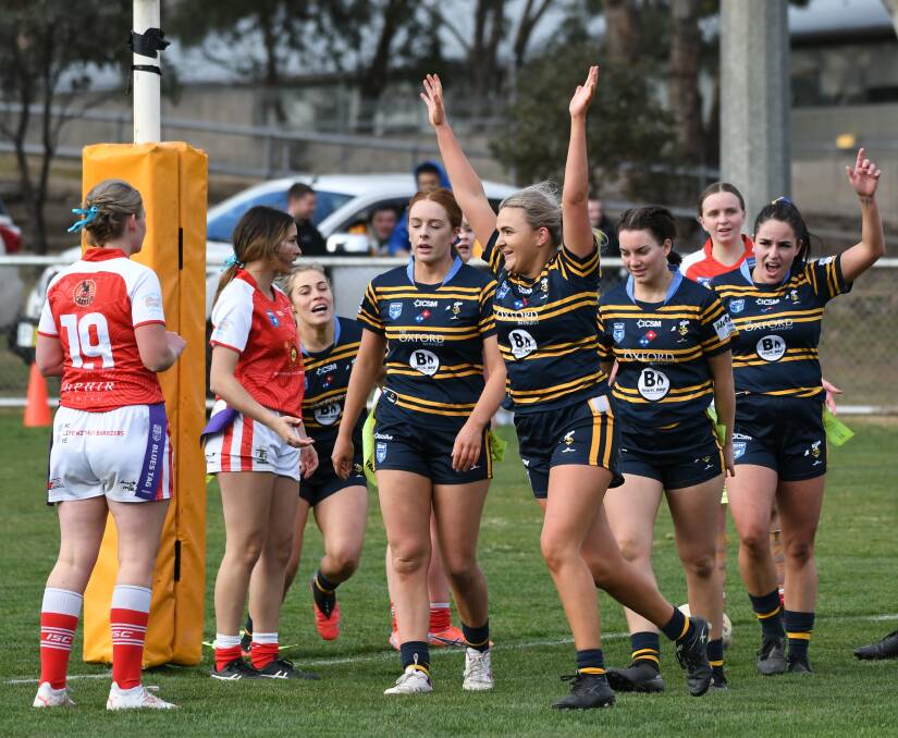THE JUBILATION: Lilly Phillips celebrates scoring her second try for the Mungals. Photo: CHRIS SEABROOK