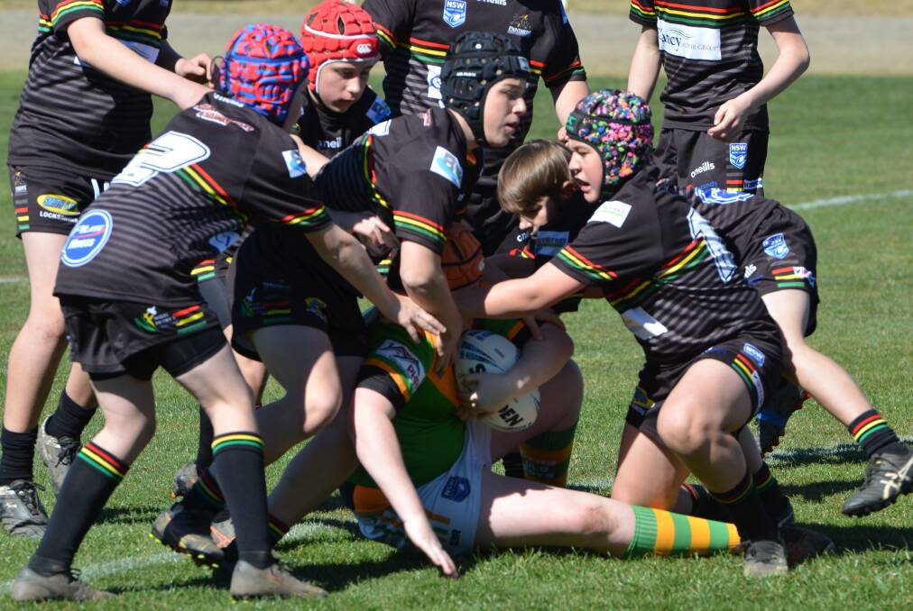 NO YOU DON'T: Bathurst Panthers scramble in defence to halt an Orange CYMS rival during their elimination semi-final. Photo: ANAY WHITELAW
