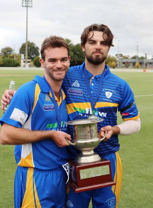 SWEET MOMENT: Nic Broes and his brother Brad pose with the BOIDC premiers cup.