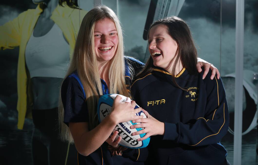 JOINING IN: Sisters Lily (left) and Bella are enjoying playing rugby union with Bathurst Bulldogs. Photo: PHIL BLATCH