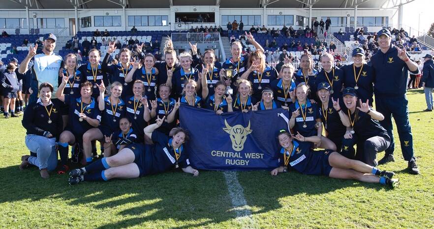 HORNS UP: Marita Shoulders (front, second from left) and her Central West Blue Bullettes team-mates celebrate their Thomson Cup triumph. Photo: NSW COUNTRY RUGBY UNION