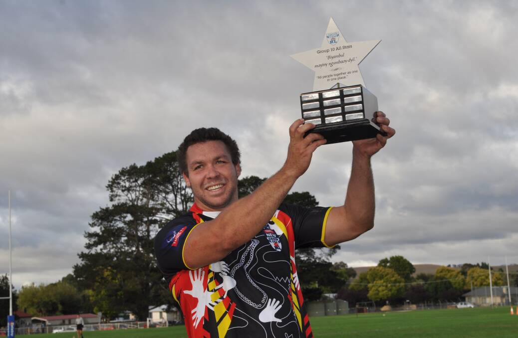 WINNER: Will Ingram holds the All Stars trophy aloft. The Indigenous All Stars have won two editions of the match.