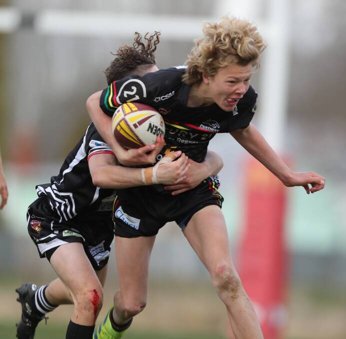 WORKING HARD: Bathurst Panthers under 15s fullback Keegan Clayton tries to make yards for his side in Saturday's grand final against Cowra. Photo: PHIL BLATCH