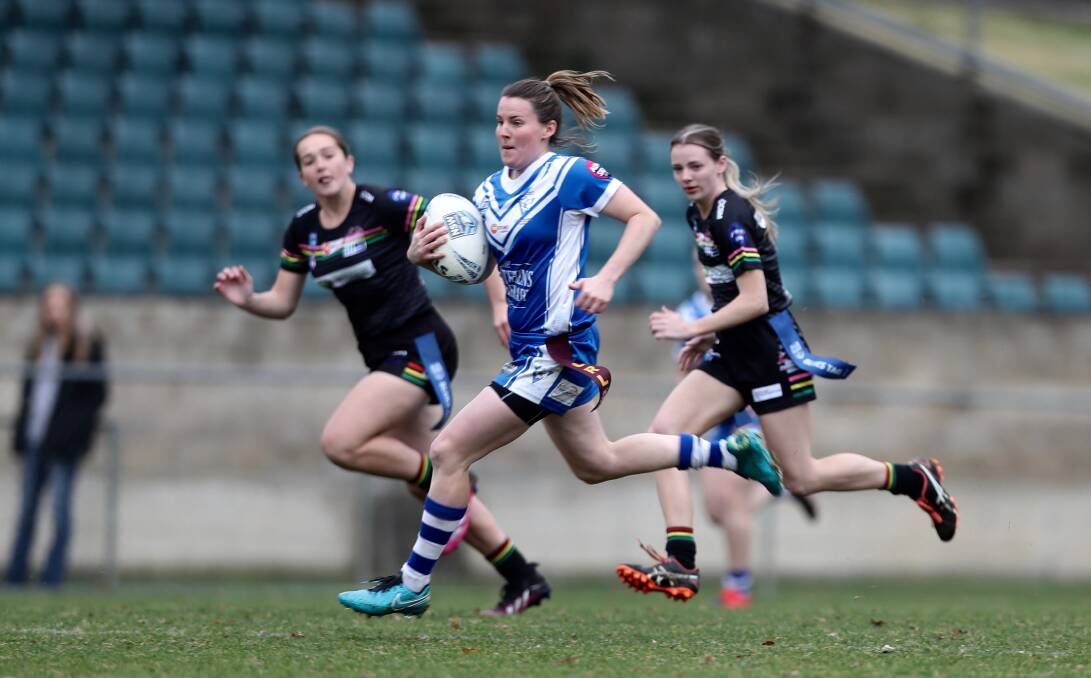 ON THE BURST: Bronte Emanuel runs away from Panthers' defence on her way to scoring one of her four tries. Photo: PHIL BLATCH