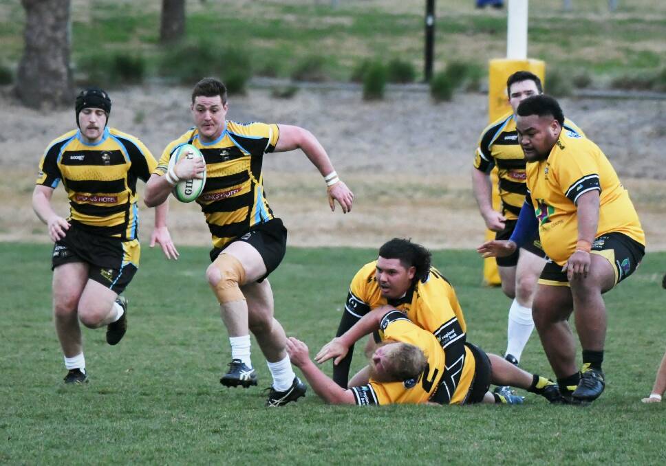 SURPRISE RESULT: CSU fullback Jonathon Lally leaves these Dubbo Rhinos in his wake during Saturday's New Holland Cup clash. He's the fourth different fullback for CSU this season. Photo: CHRIS SEABROOK 072322csu4