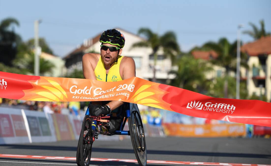 GOLDEN MOMENT: Kurt Fearnley, pictured winning the Gold Coast marathon, is a finalist in inaugural Sport Australia Award. Photo: AAP